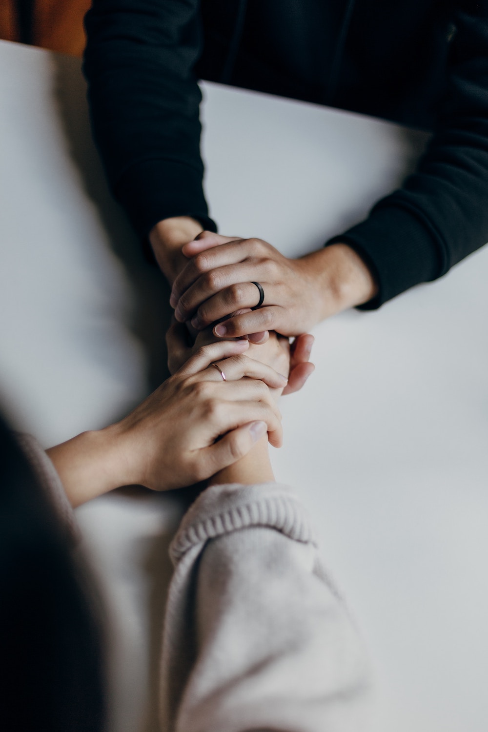 Couple holding hands the redeemed marriage podcast image credit priscilla du preez apa843frizi unsplash